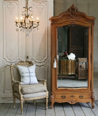 Armoire and Plush armchair with chandelier 