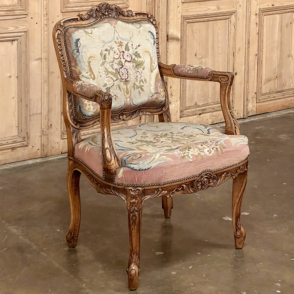 19th century French Louis XVI style arm chair with tapestry upholstery.