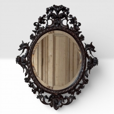 Late 19th to Early 20th Century Renaissance Revival Hand-Carved Beveled Mirror